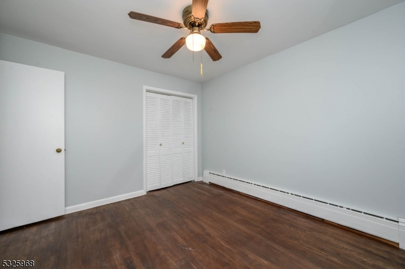 136 Valpeck Avenue, Unit 1 Raritan, NJ 08869 - Photo 27 of 37 wooden floor in an empty room