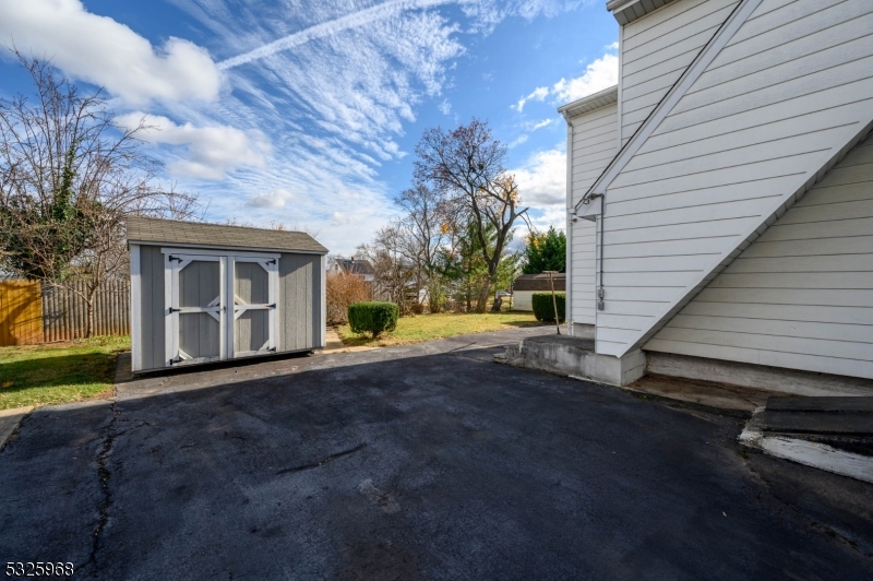 136 Valpeck Avenue, Unit 1 Raritan, NJ 08869 - Photo 33 of 37 a view of a house with backyard and garden