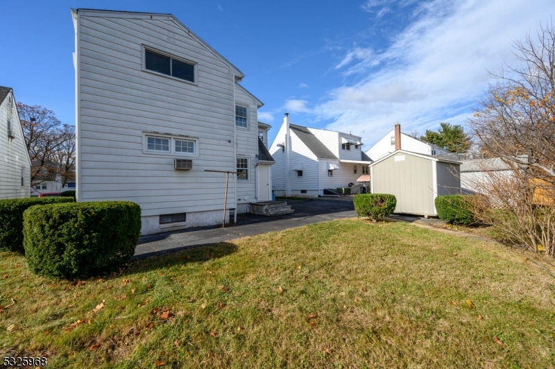136 Valpeck Avenue, Unit 1 Raritan, NJ 08869 - Photo 35 of 37 a view of a house with a backyard