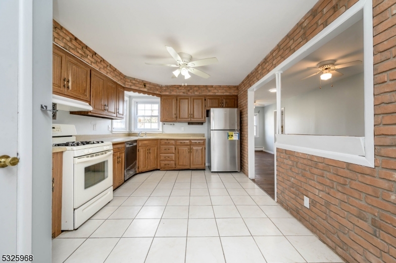 136 Valpeck Avenue, Unit 1 Raritan, NJ 08869 - Photo 8 of 37 a kitchen with a cabinets and white stainless steel appliances