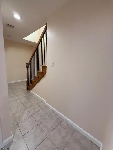 a view of entryway and hall with a window
