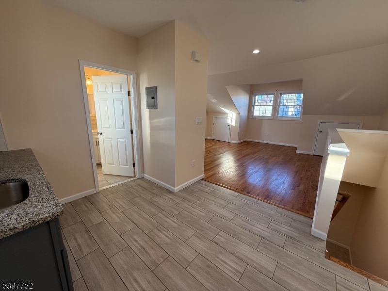 208 Walnut Street Newark, NJ 07105 - Photo 15 of 18 a view of empty room with wooden floor