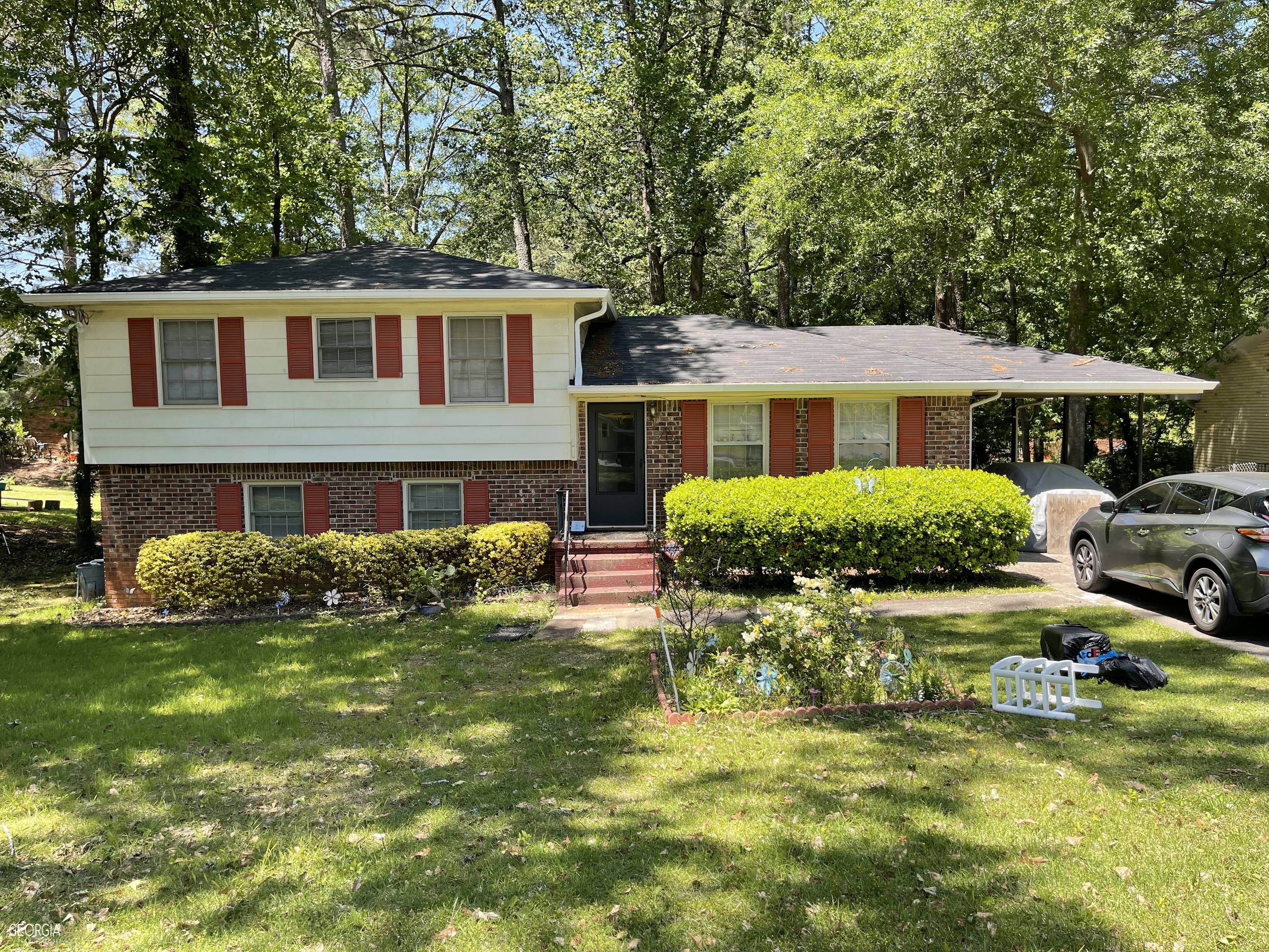 1065 Dove Valley Road Decatur, GA 30032 - Photo 1 of 1 a front view of a house with a garden