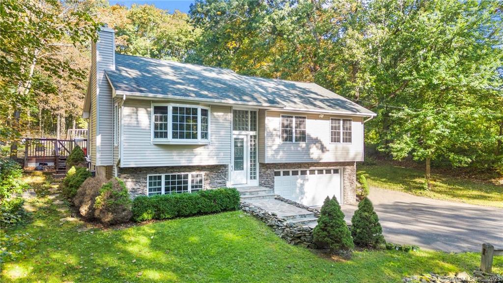306 Silver Hill Road Derby, CT 06418 - Photo 1 of 1 a view of a house with a yard and a large tree