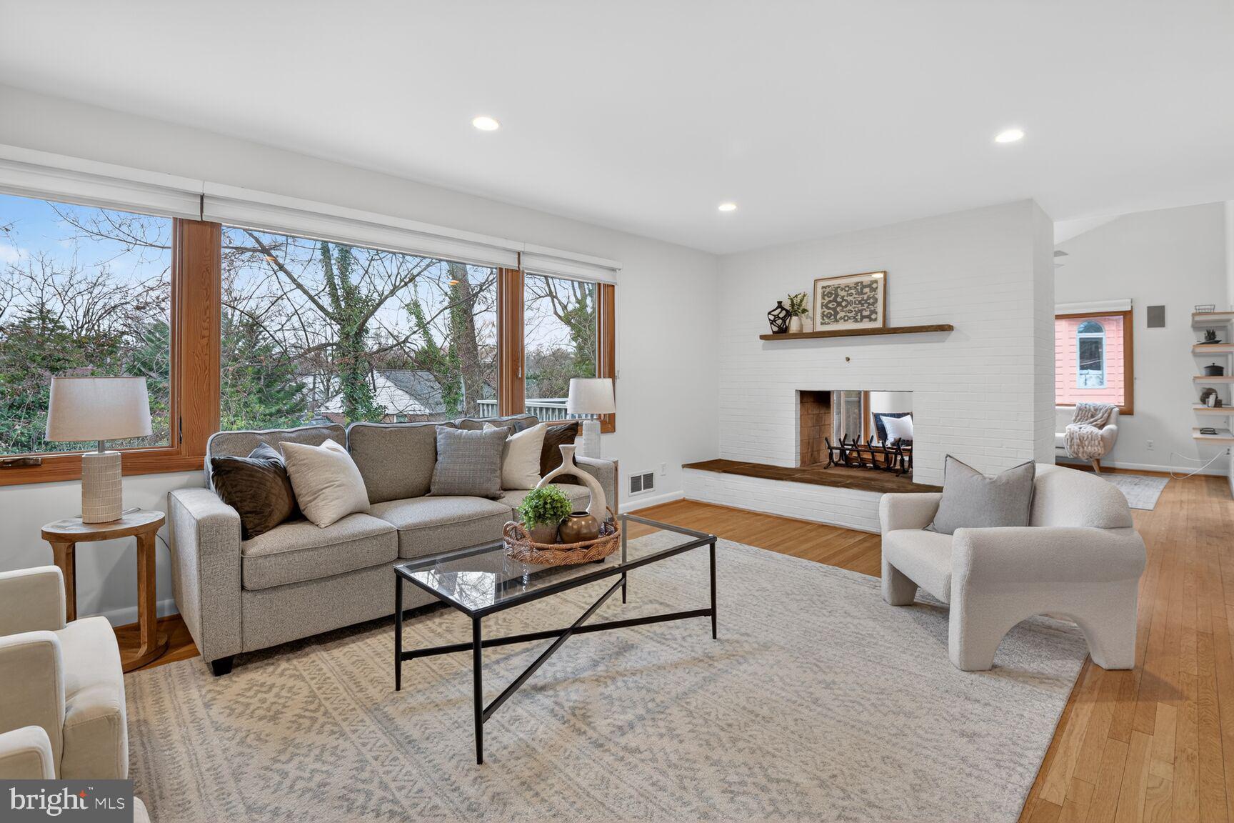 6104 Robinwood Road Bethesda, MD 20817 - Photo 17 of 45 a living room with furniture and a large window