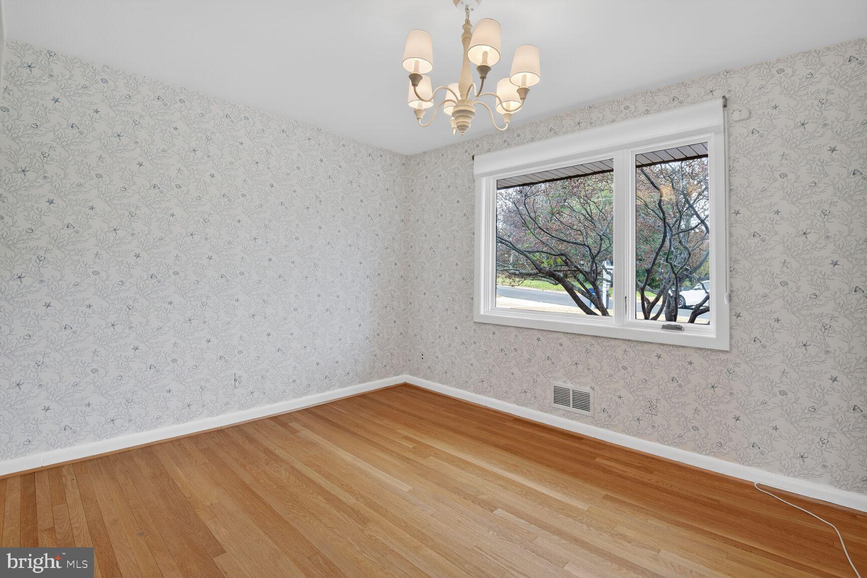 6104 Robinwood Road Bethesda, MD 20817 - Photo 20 of 45 wooden floor in an empty room with a window