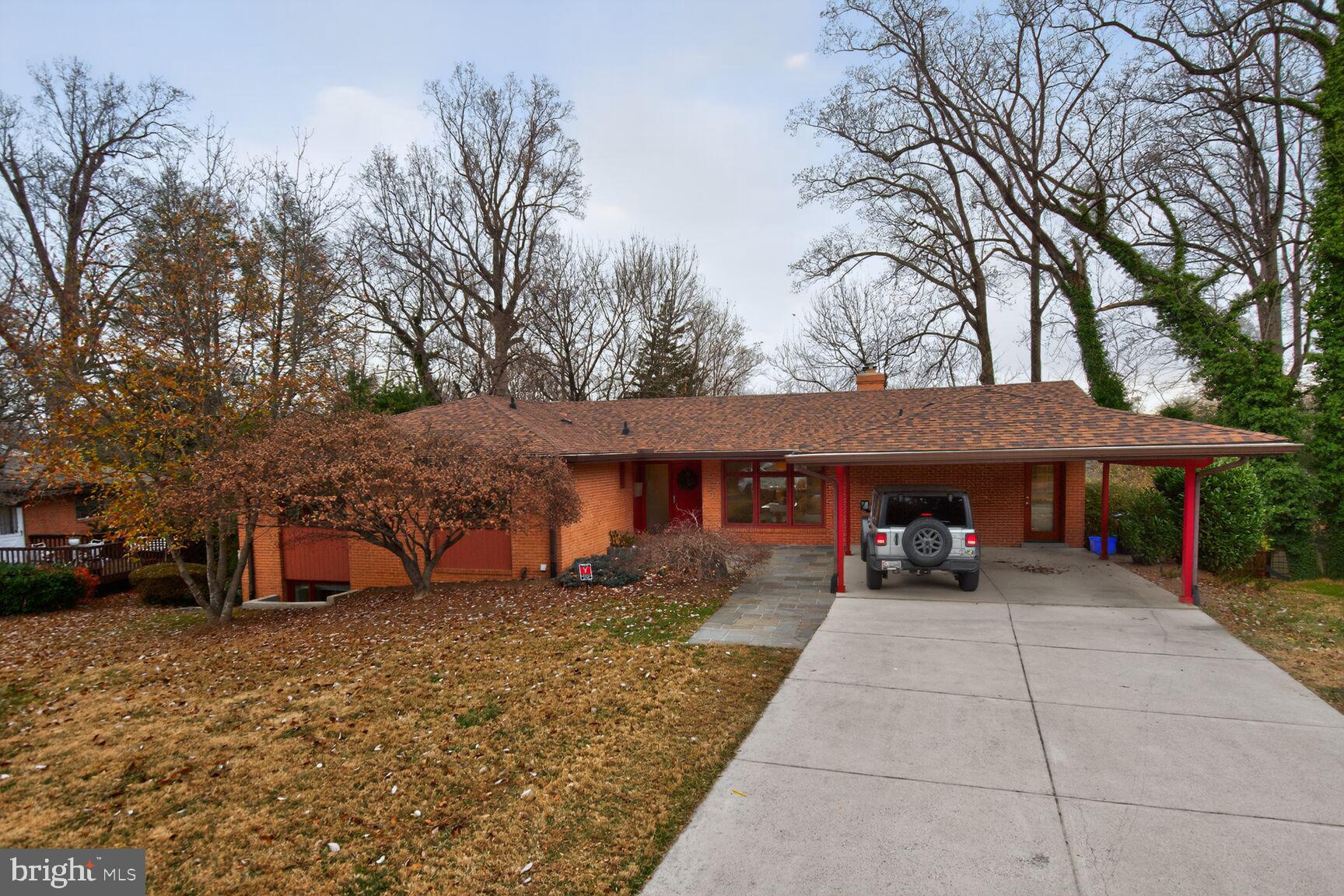 6104 Robinwood Road Bethesda, MD 20817 - Photo 2 of 45 a view of a house with backyard and trees