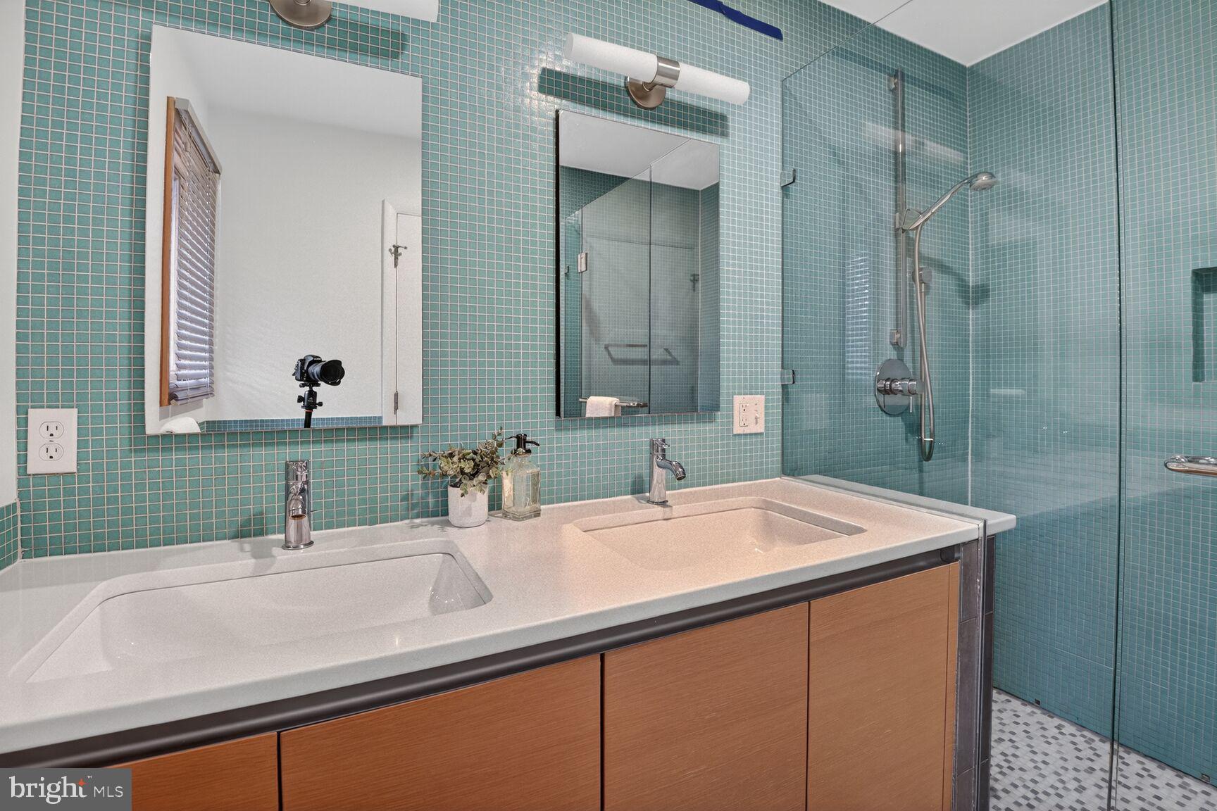 6104 Robinwood Road Bethesda, MD 20817 - Photo 24 of 45 a bathroom with a sink and a mirror