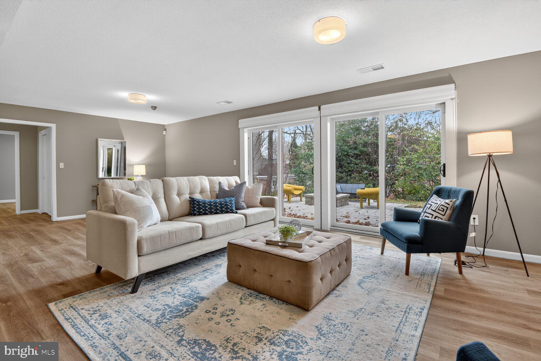 6104 Robinwood Road Bethesda, MD 20817 - Photo 28 of 45 a living room with furniture and a large window