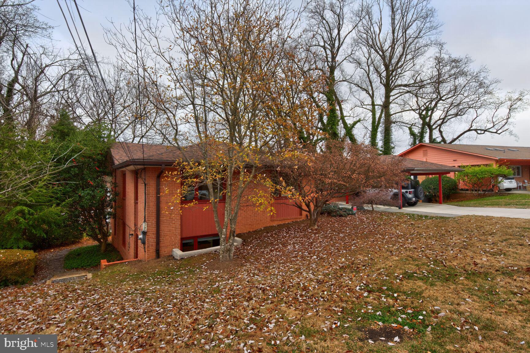 6104 Robinwood Road Bethesda, MD 20817 - Photo 42 of 45 a view of a house with backyard and trees