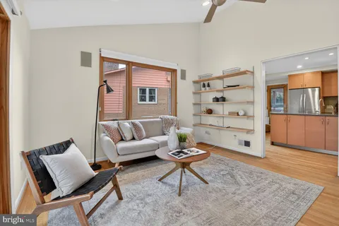 a living room with furniture and a rug