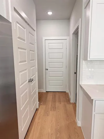 a view of a hallway with closet