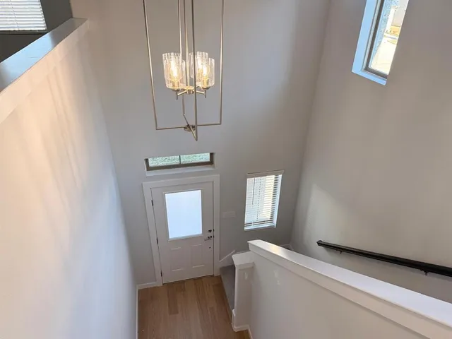 a view of front door with chandelier