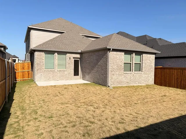 a house with trees in the background