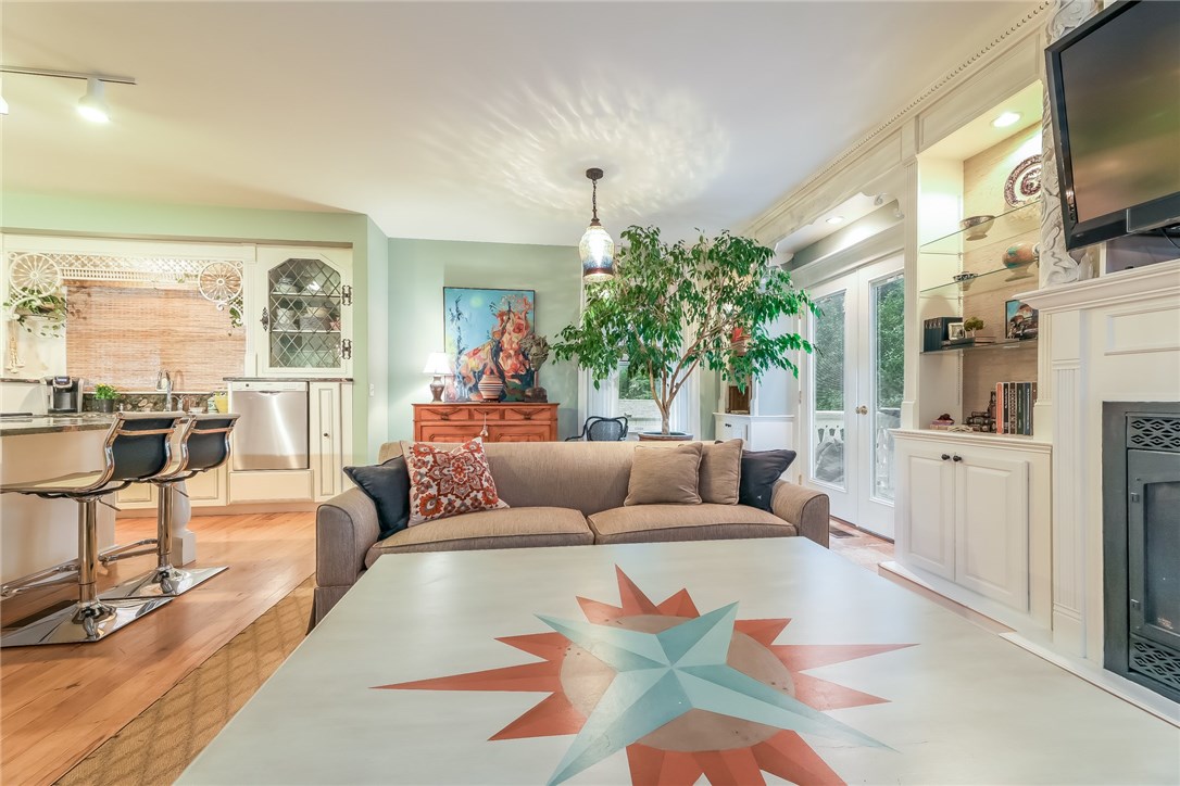 32 Broad Street Warren, RI 02885 - Photo 11 of 40 Family Room off kitchen with gas fireplace and custom bookcases.
