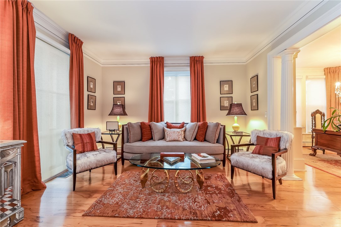 32 Broad Street Warren, RI 02885 - Photo 18 of 40 Formal living room with columns opens to library.
