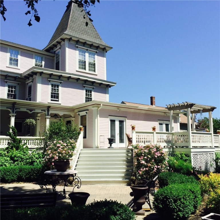 32 Broad Street Warren, RI 02885 - Photo 2 of 40 Grand wraparound porch & staircase extending to the back off the kitchen.