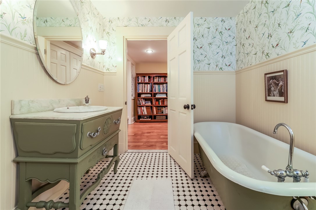 32 Broad Street Warren, RI 02885 - Photo 23 of 40 Jack & Jill bathroom layout with antique porcelain soaking tub and antique base sink with marble top.