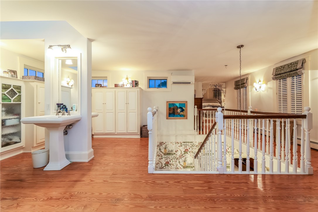 32 Broad Street Warren, RI 02885 - Photo 32 of 40 En suite master bath on 3rd fl with his and her sinks, custom closets with antique stain glass doors.
