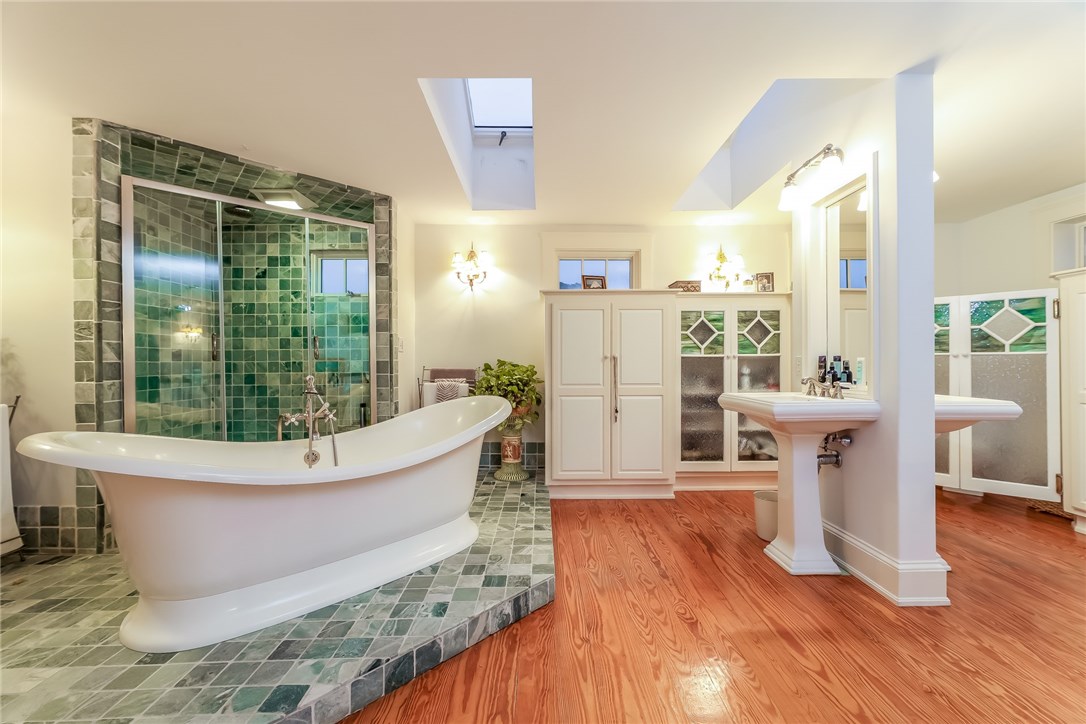 32 Broad Street Warren, RI 02885 - Photo 33 of 40 En suite master bath with soaking tub, lg. shower, antique stained glass doors for water closet