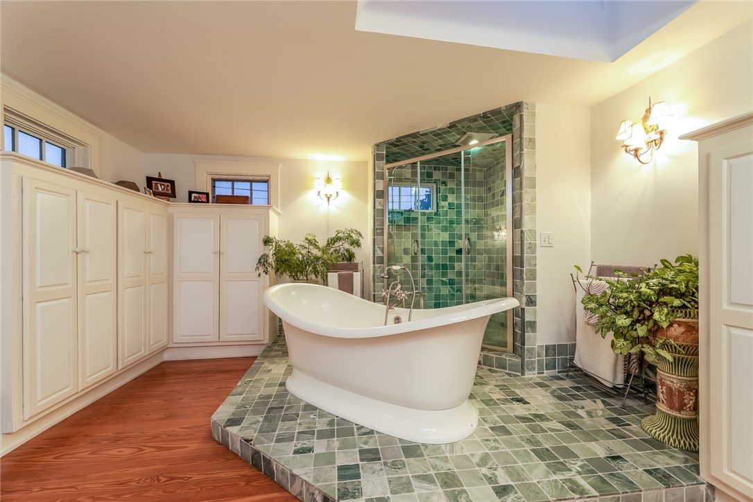 32 Broad Street Warren, RI 02885 - Photo 34 of 40 Soaking tub and double shower on marble platform with custom closets in monitor.