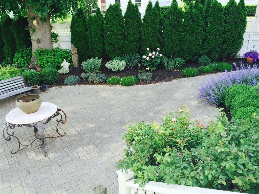 32 Broad Street Warren, RI 02885 - Photo 36 of 40 Patio surrounded by lovely perennial gardens