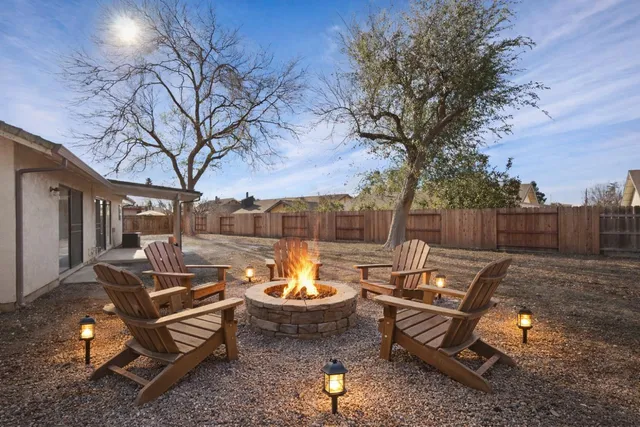 a view of a backyard with a patio