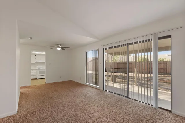 a view of an empty room with a fireplace