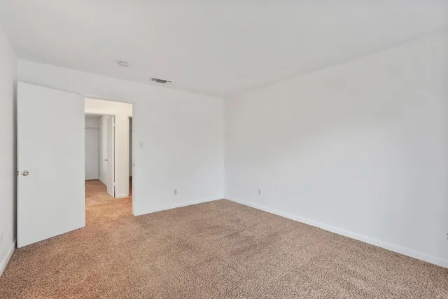 a bathroom with a shower sink vanity and toilet