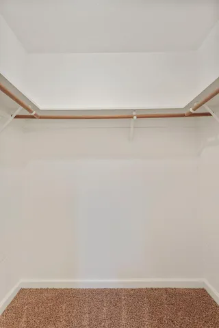 a view of a backyard with a patio and fire pit