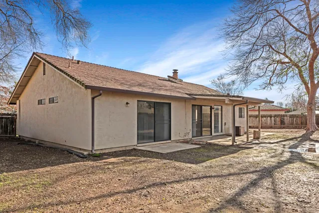 a big house with trees in front of it