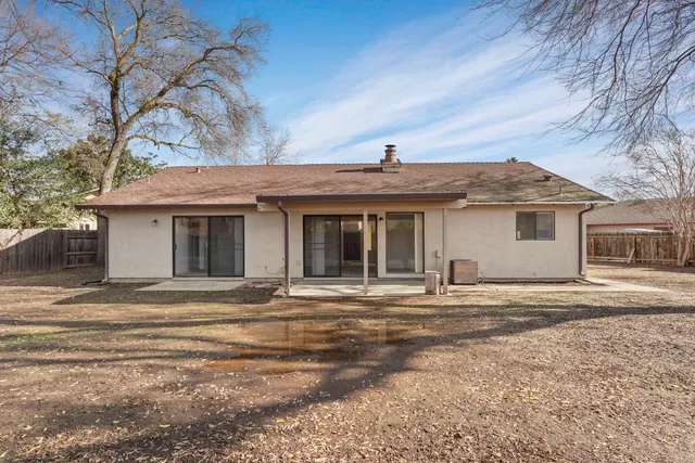 a view of a house with a snow in the yard