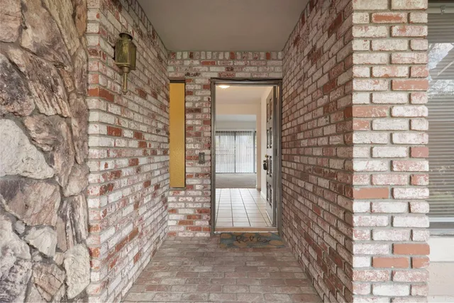 a view of a hallway to closet area