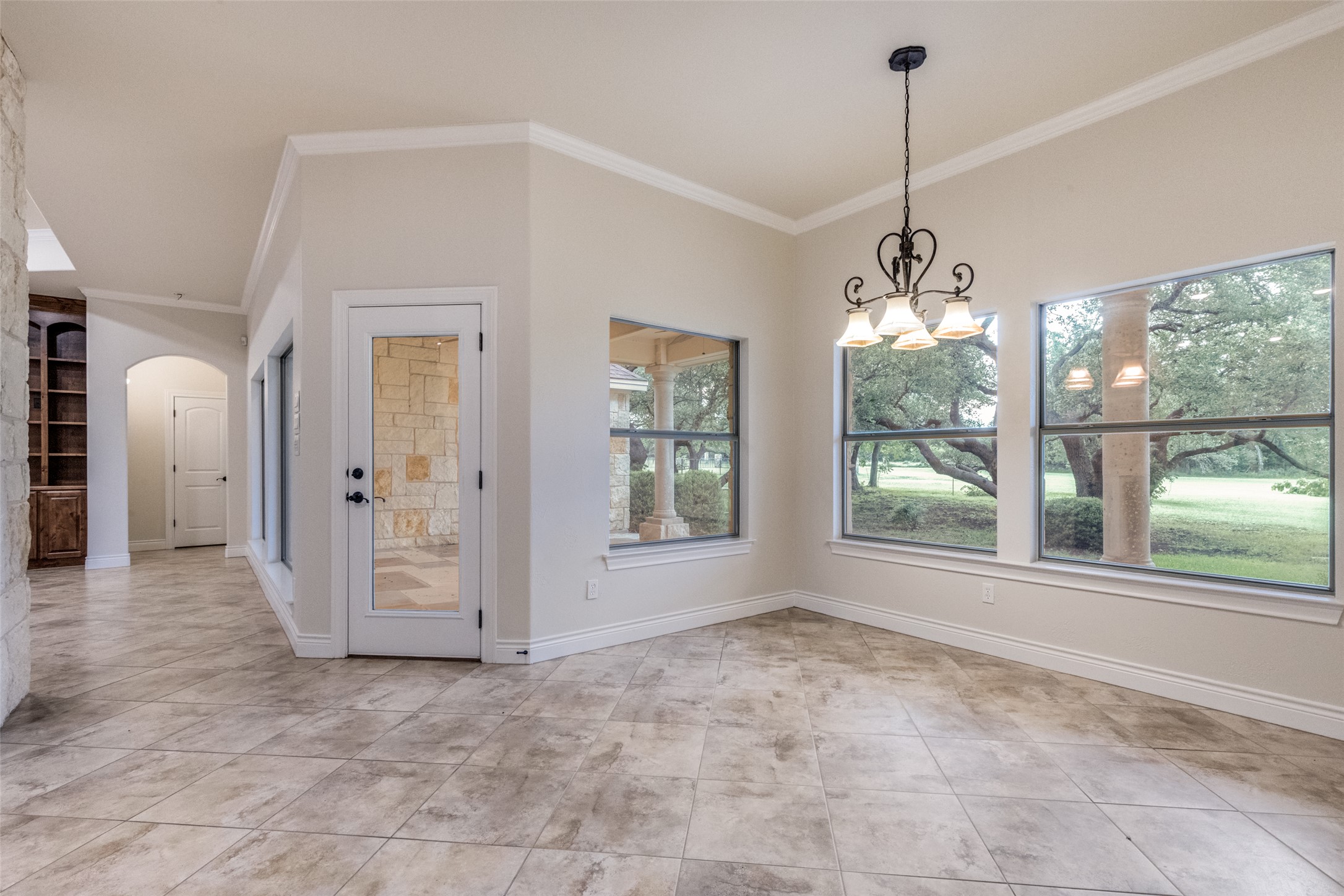 101 Copper Leaf Court Georgetown, TX 78633 - Photo 10 of 31 Interior dining area featuring neutral-toned walls, tile flooring, and a decorative chandelier