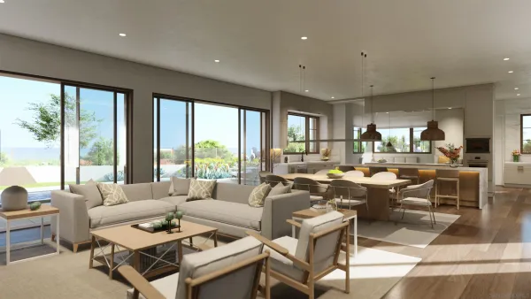 a living room with lots of furniture and a large window