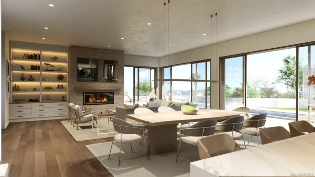 a room with furniture a large window and a fireplace