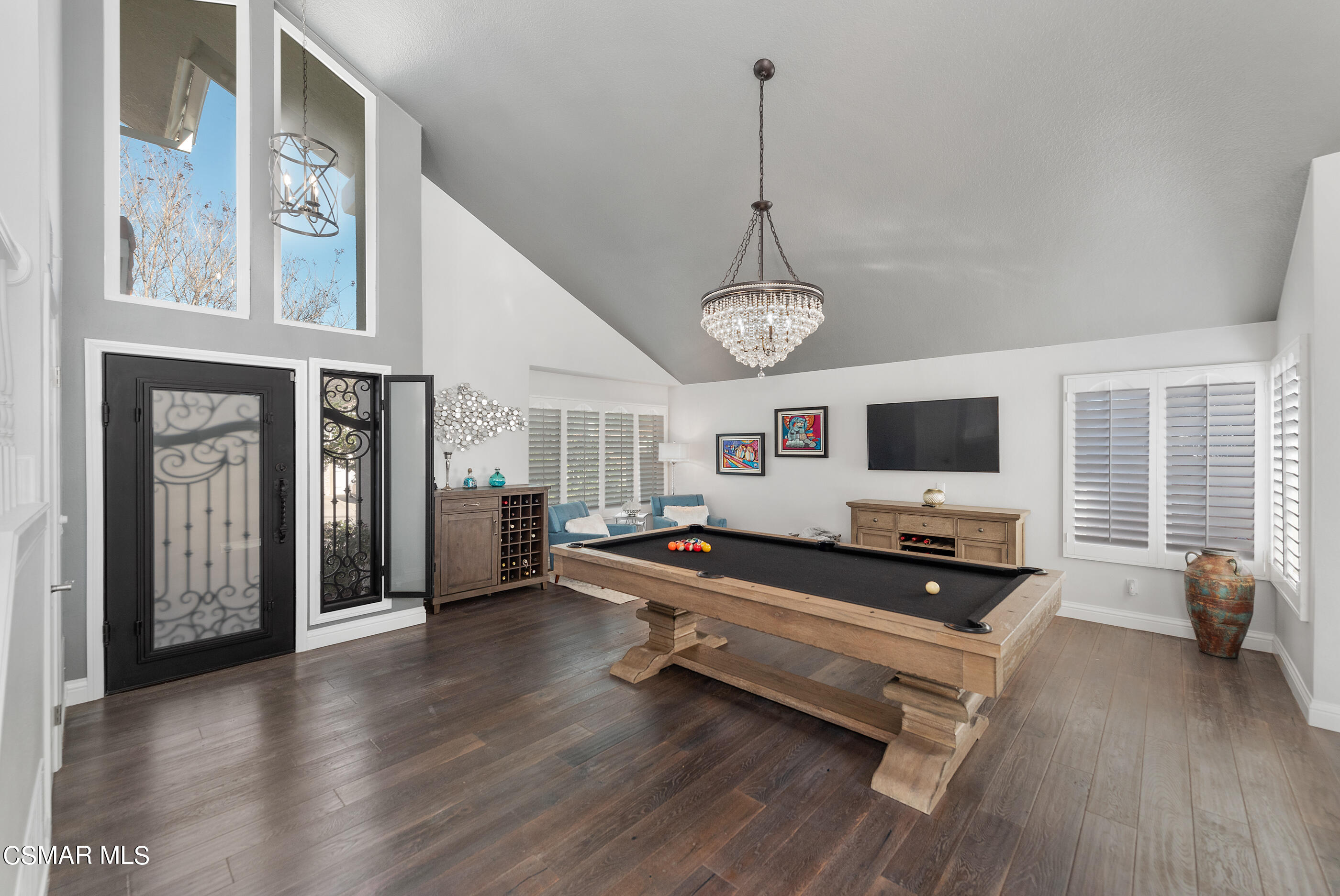 3233 Crazy Horse Drive Simi Valley, CA 93063 - Photo 16 of 65 a living room with furniture flat screen tv and wooden floor