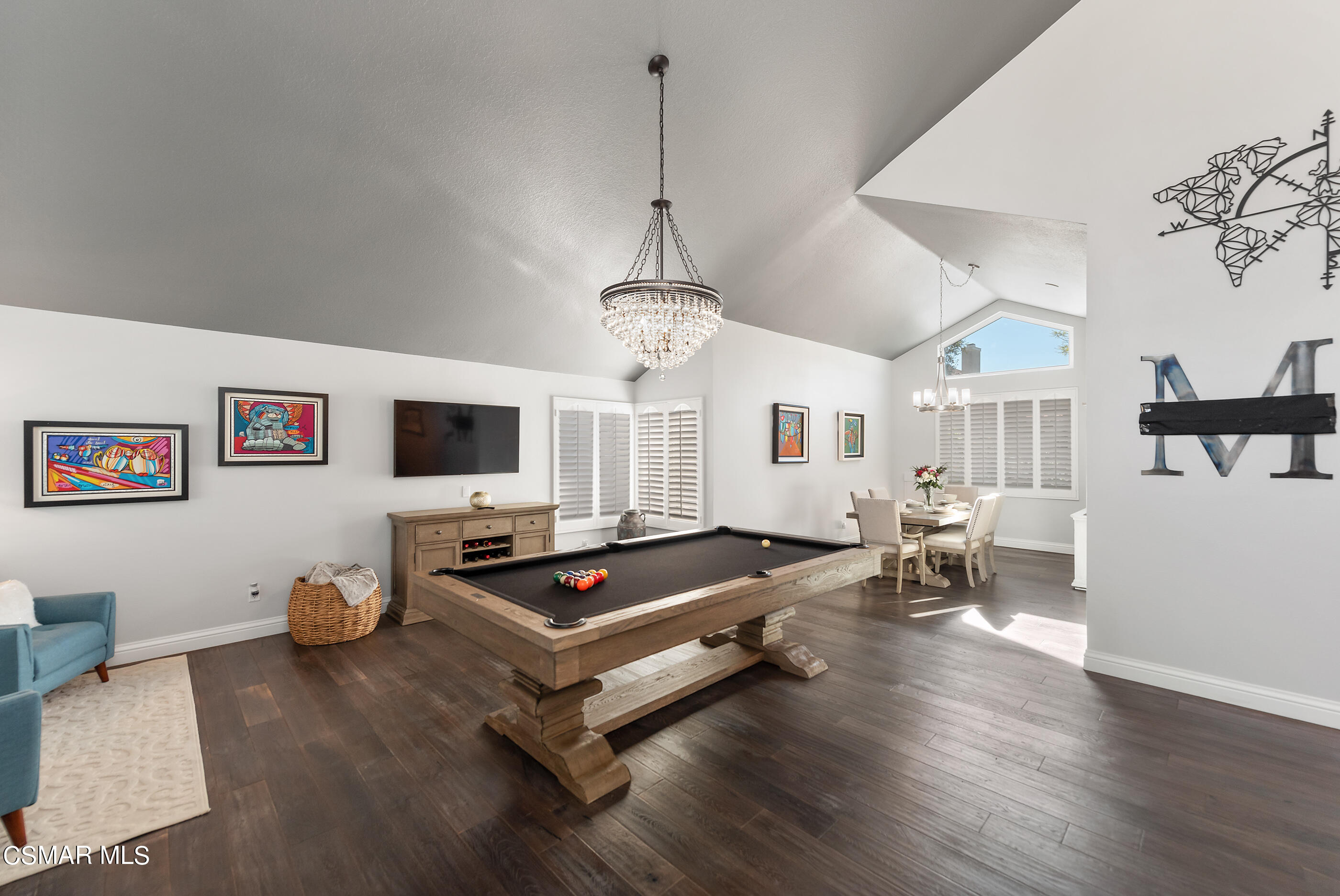 3233 Crazy Horse Drive Simi Valley, CA 93063 - Photo 17 of 65 a living room with furniture a flat screen tv and kitchen view