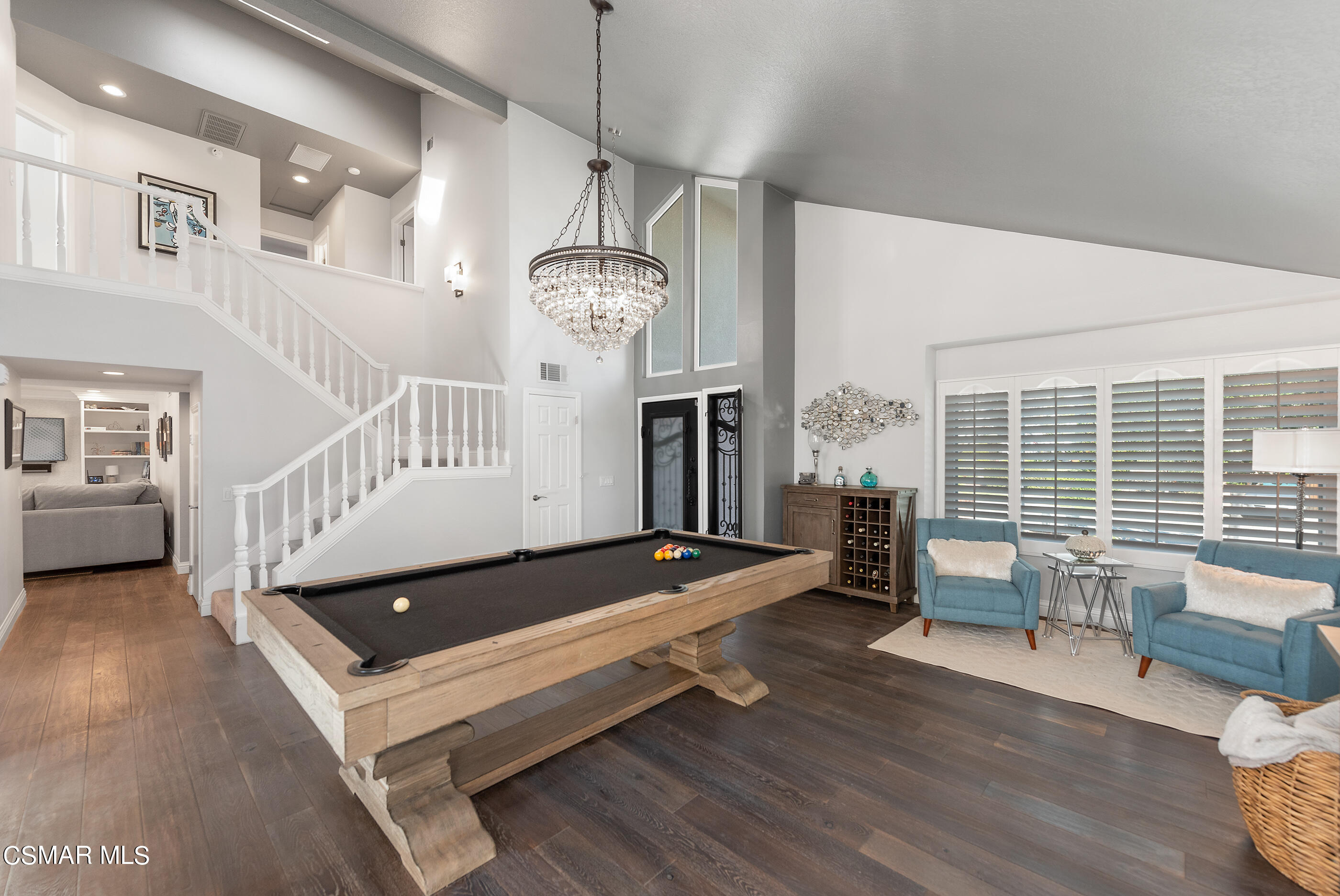 3233 Crazy Horse Drive Simi Valley, CA 93063 - Photo 19 of 65 a living room with furniture pool table wooden floor and windows