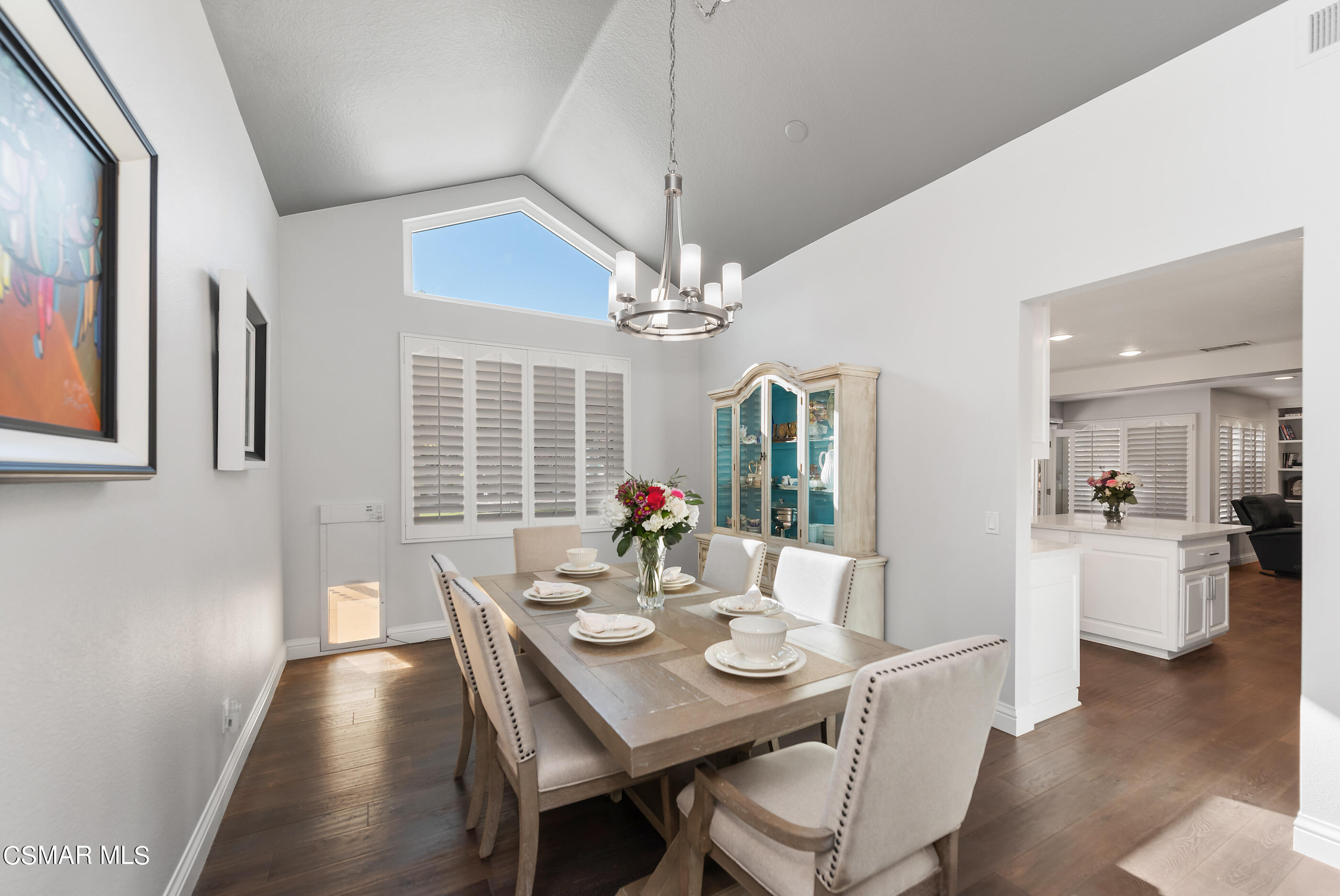 3233 Crazy Horse Drive Simi Valley, CA 93063 - Photo 20 of 65 a view of a dining room with furniture wooden floor and chandelier