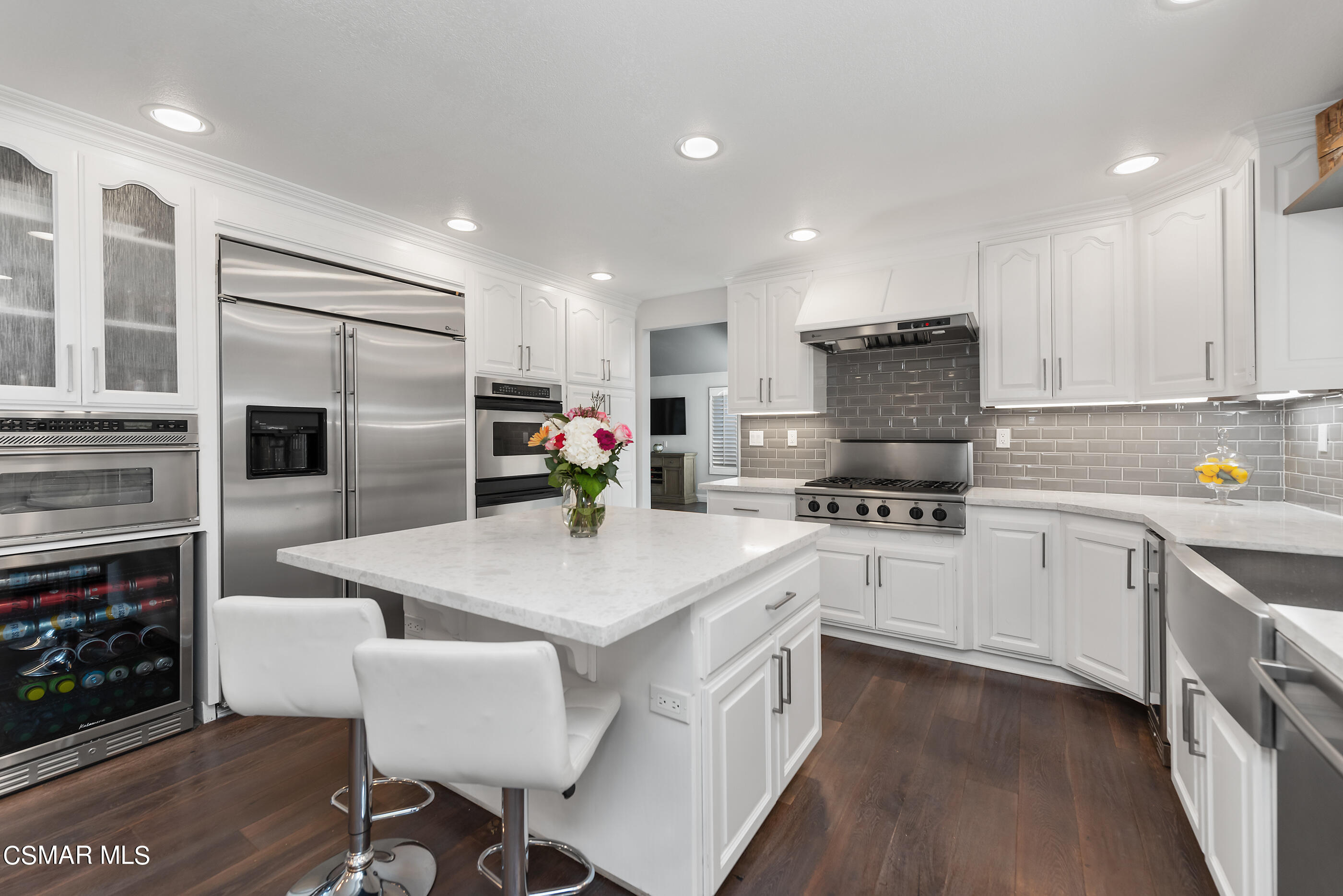 3233 Crazy Horse Drive Simi Valley, CA 93063 - Photo 23 of 65 a kitchen with granite countertop a sink stove and refrigerator