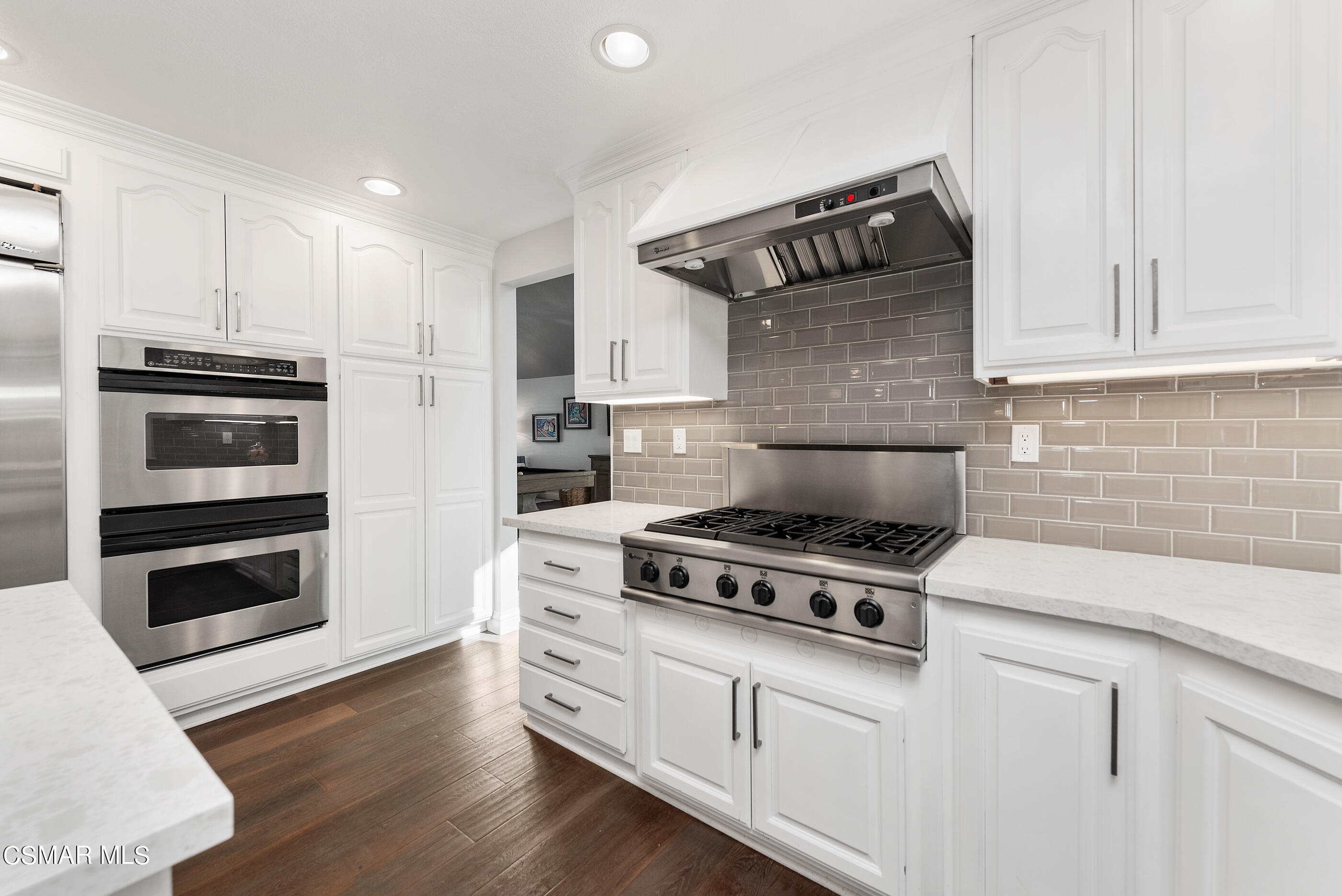 3233 Crazy Horse Drive Simi Valley, CA 93063 - Photo 24 of 65 a kitchen with appliances and cabinets