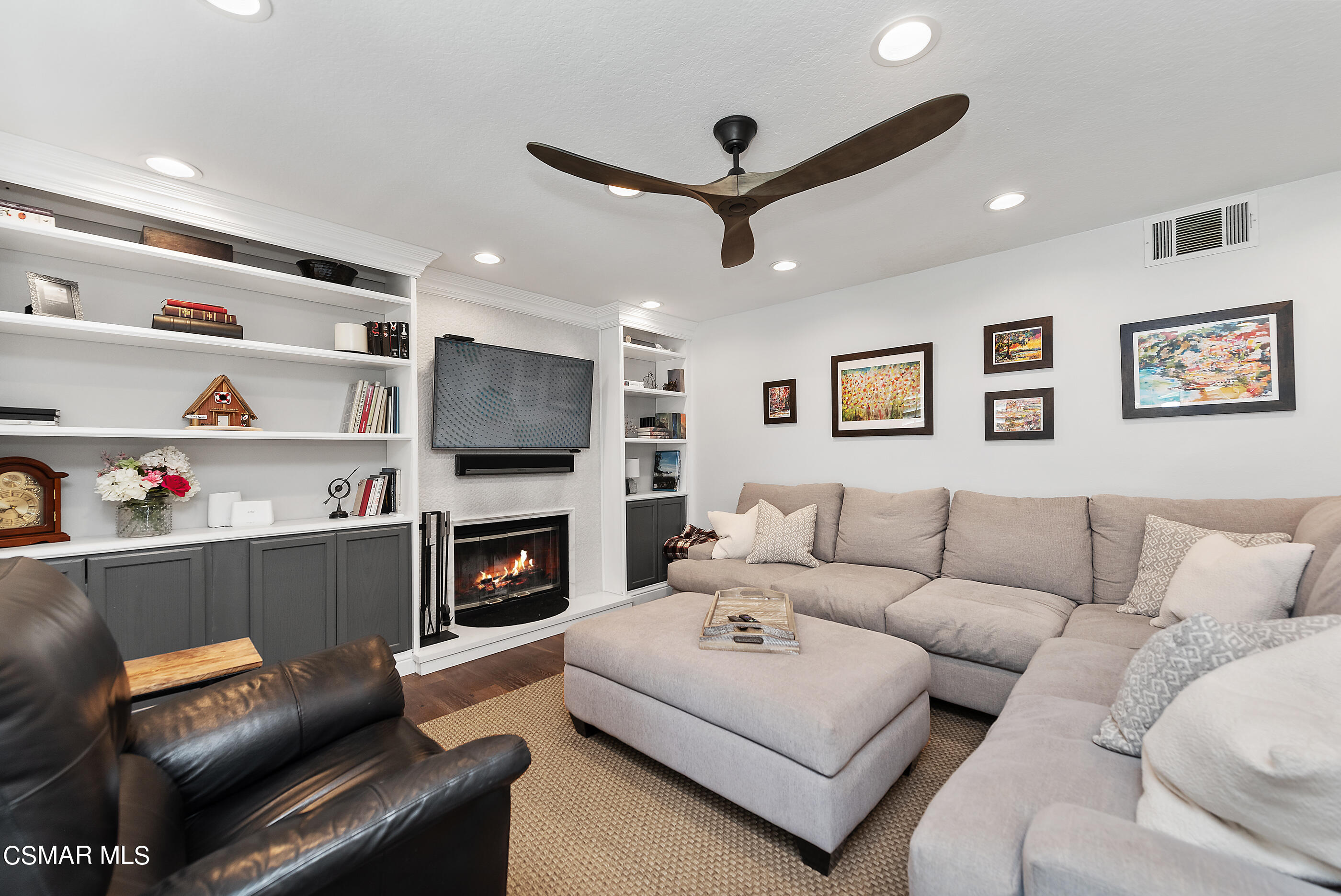 3233 Crazy Horse Drive Simi Valley, CA 93063 - Photo 27 of 65 a living room with furniture and a fireplace