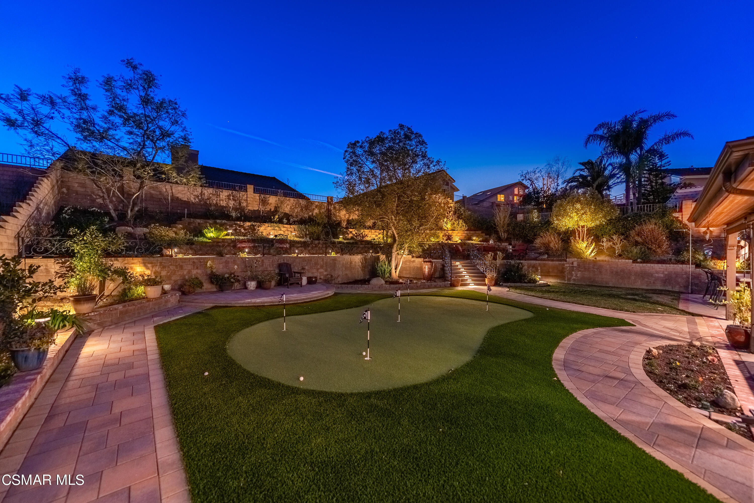 3233 Crazy Horse Drive Simi Valley, CA 93063 - Photo 3 of 65 a view of a swimming pool with lawn chairs under an umbrella