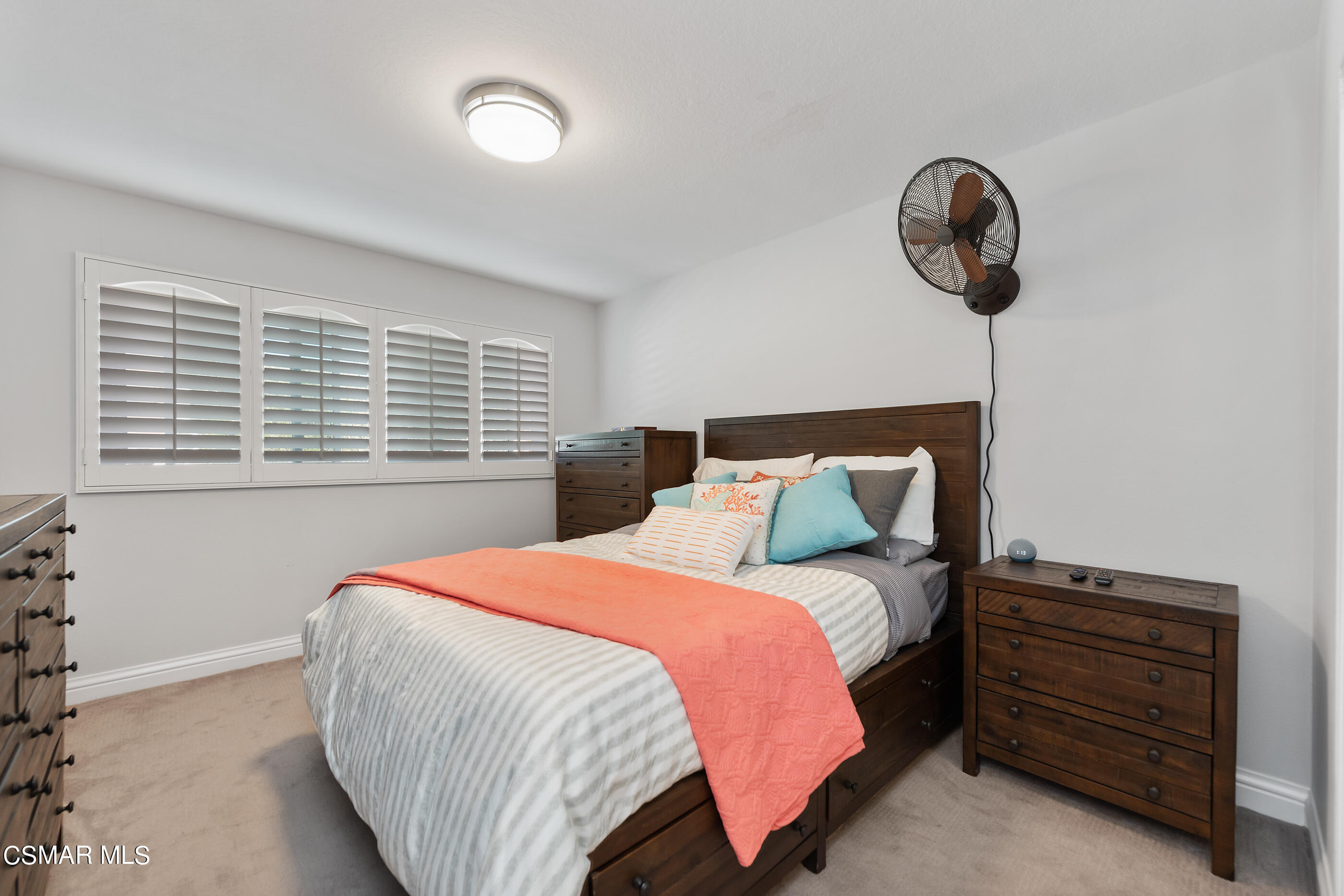 3233 Crazy Horse Drive Simi Valley, CA 93063 - Photo 34 of 65 a bedroom with a bed and a window