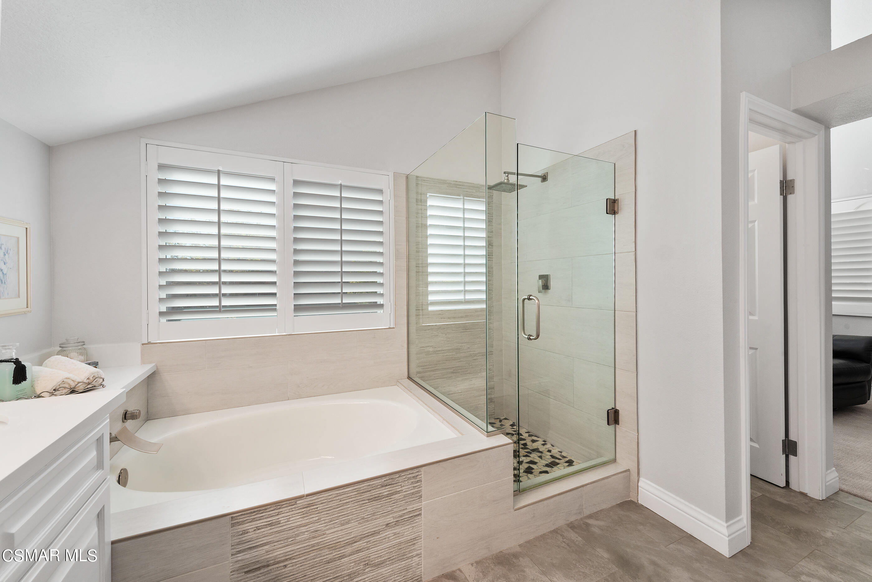 3233 Crazy Horse Drive Simi Valley, CA 93063 - Photo 41 of 65 a bathroom with a bathtub and a shower