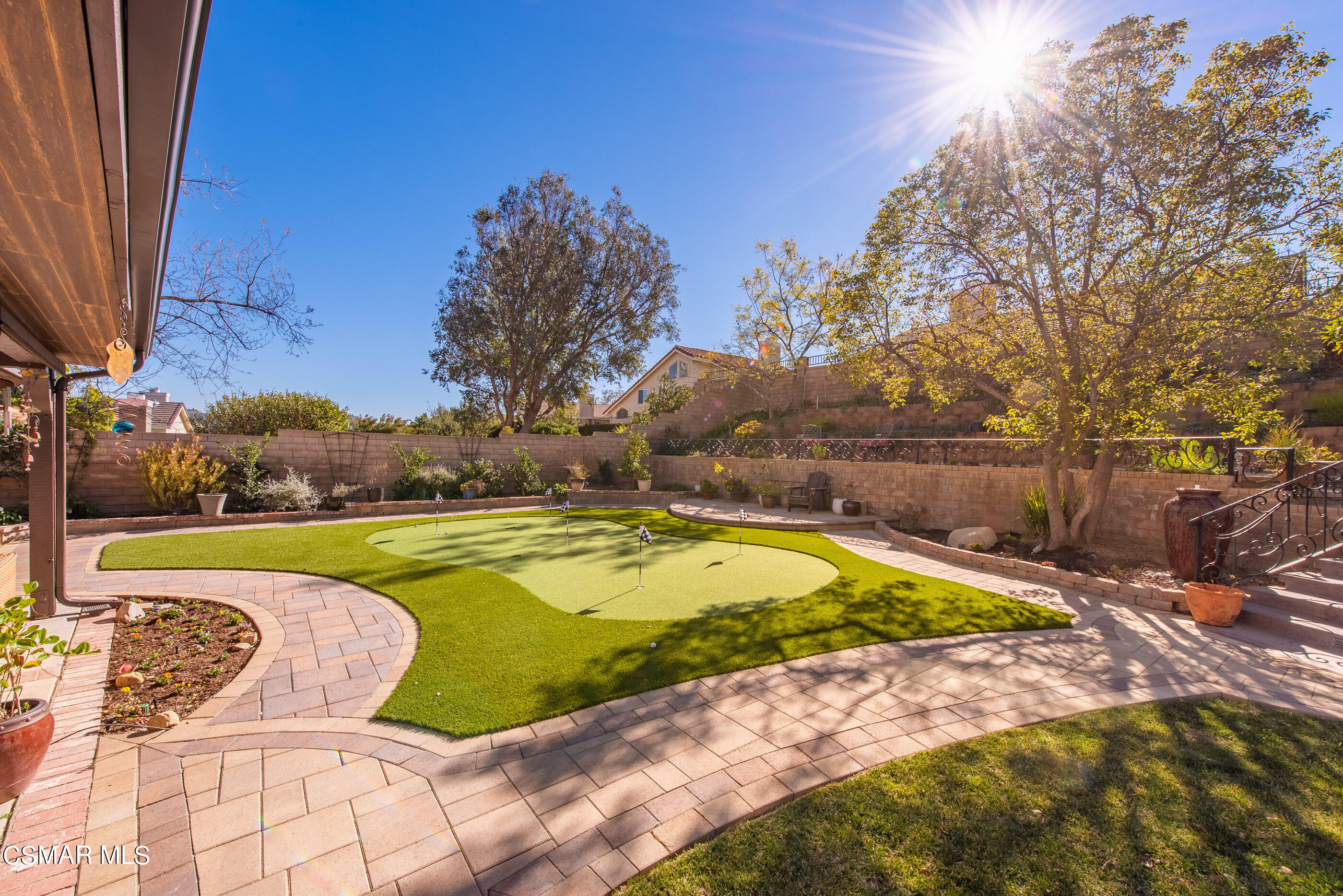 3233 Crazy Horse Drive Simi Valley, CA 93063 - Photo 47 of 65 a view of a swimming pool and trees in the background