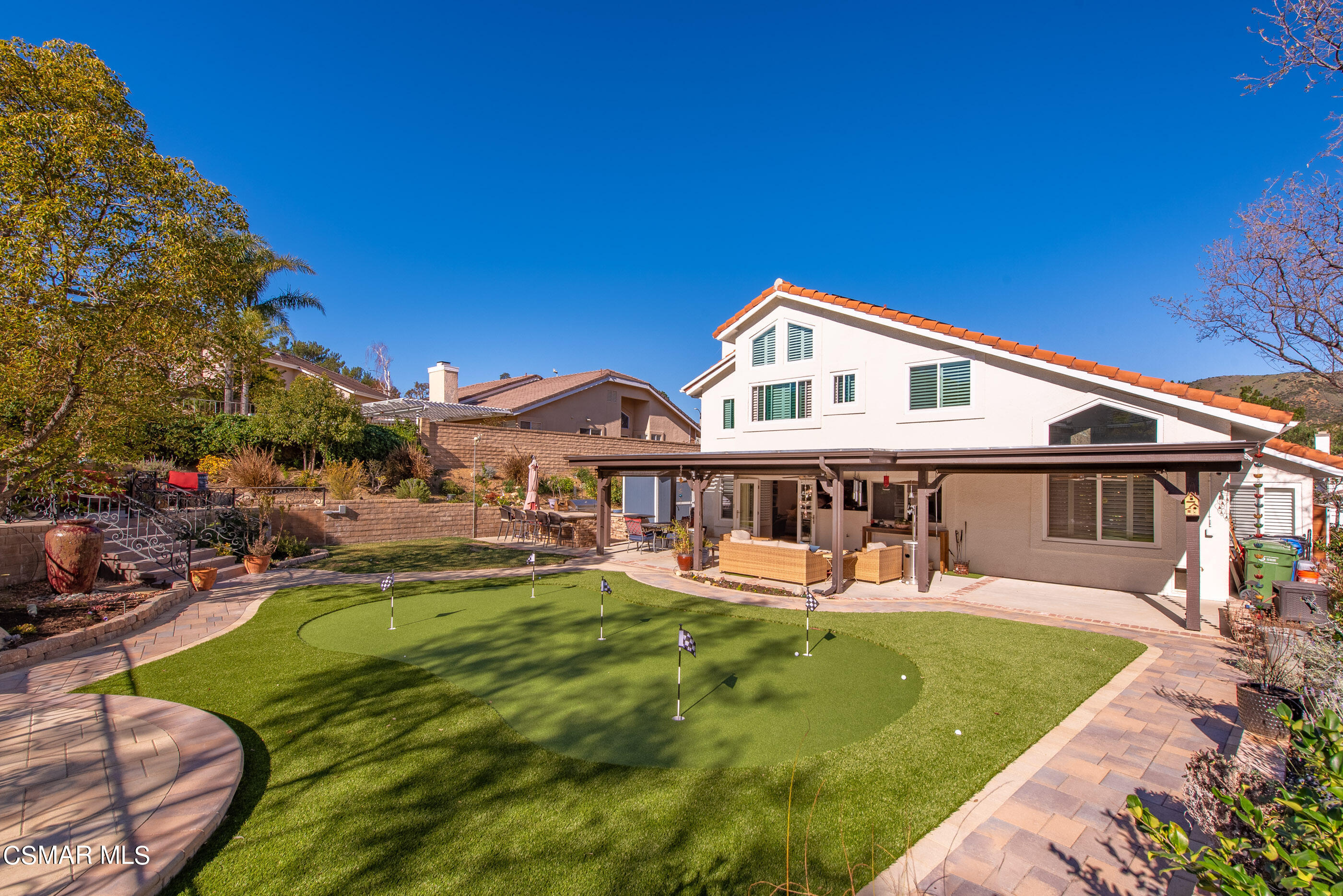 3233 Crazy Horse Drive Simi Valley, CA 93063 - Photo 49 of 65 a front view of a house with swimming pool having outdoor seating