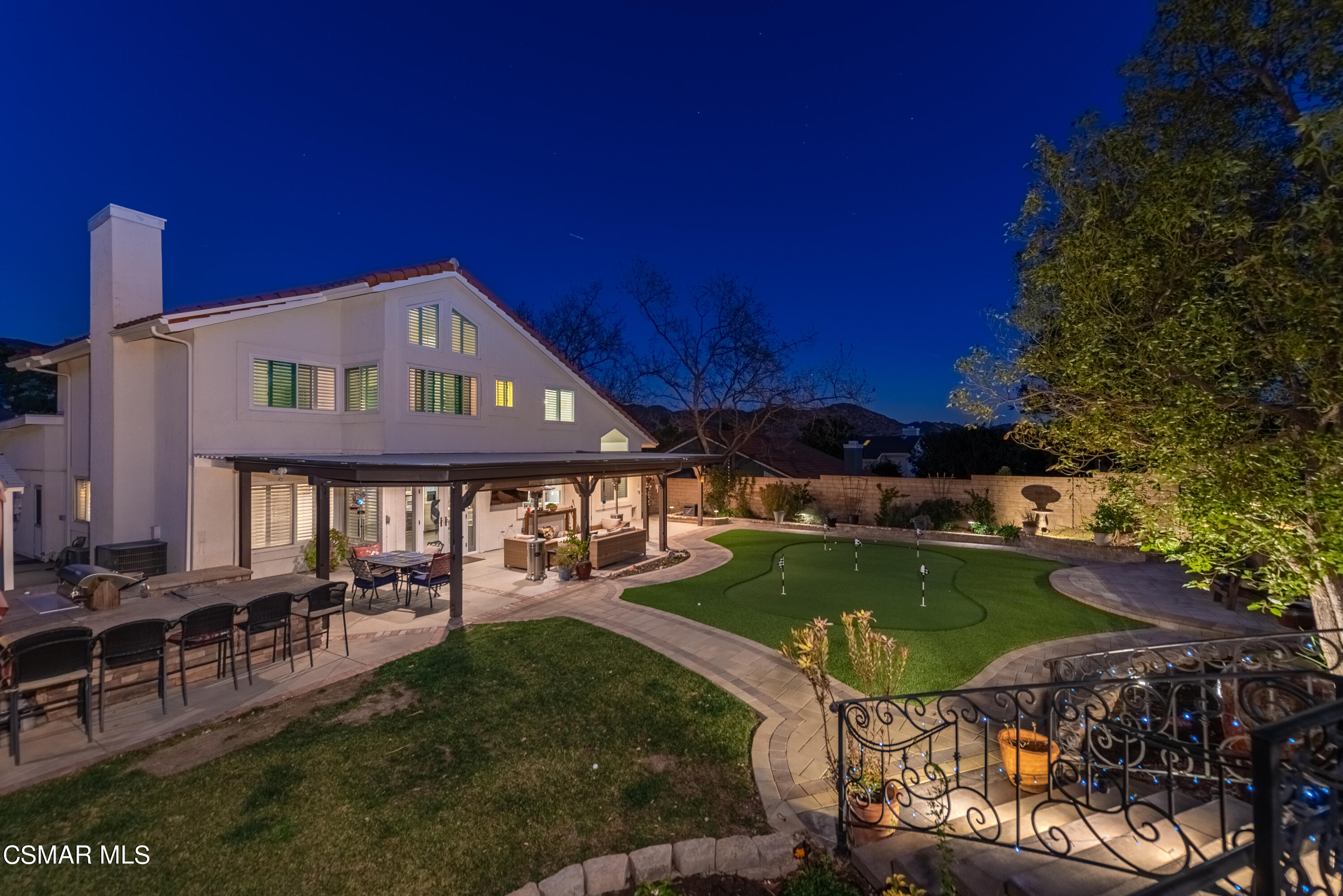 3233 Crazy Horse Drive Simi Valley, CA 93063 - Photo 5 of 65 a view of a house with backyard outdoor seating area and furniture