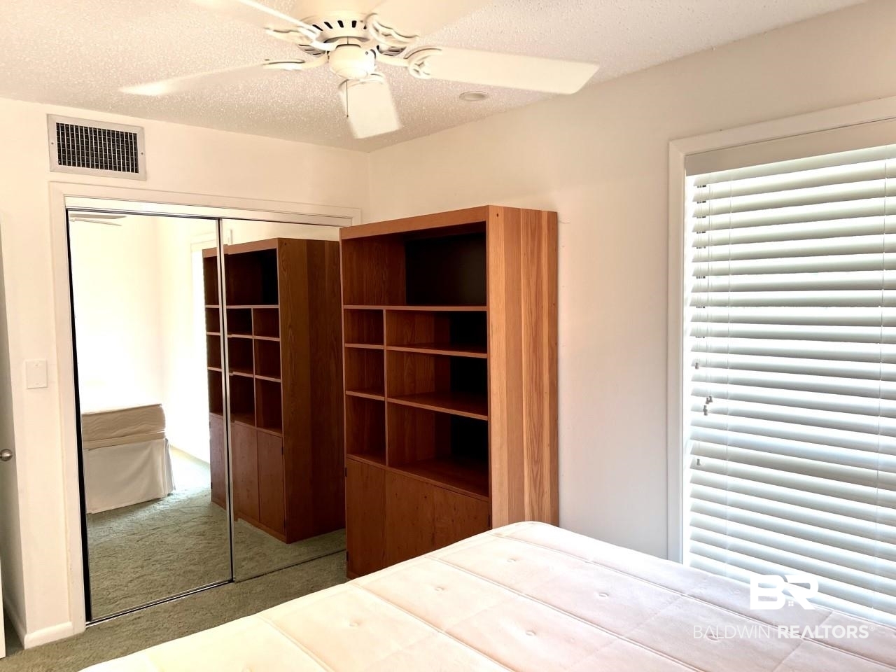 208 Golf Terrace, Unit 208 Daphne, AL 36526 - Photo 15 of 22 Bedroom shelving remains
